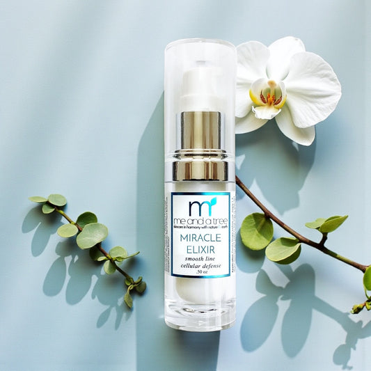 Me and a Tree Miracle Elixir smoothing face serum with orchid flower and greenery on a soft blue background